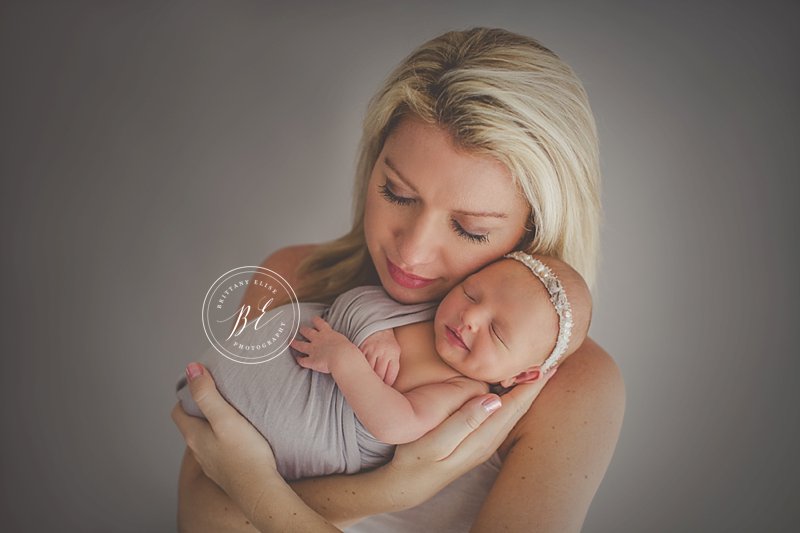 soft pink and purple baby girl newborn session in Tampa, Florida
