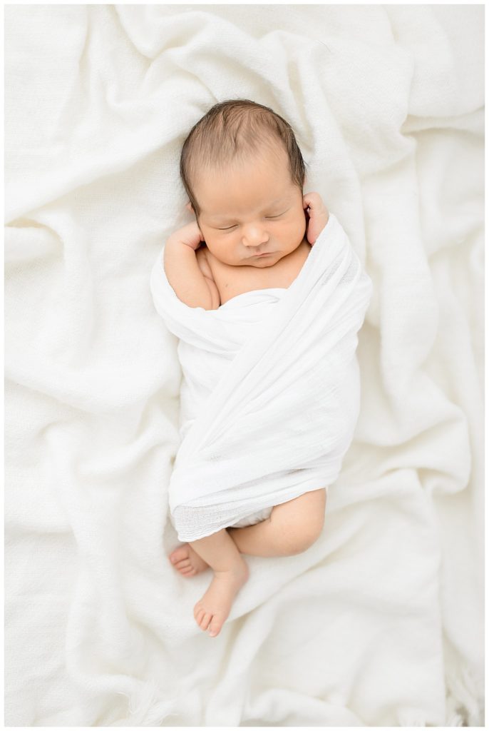 Newborn natural lighting Tampa photographer taking beautiful baby studio photos