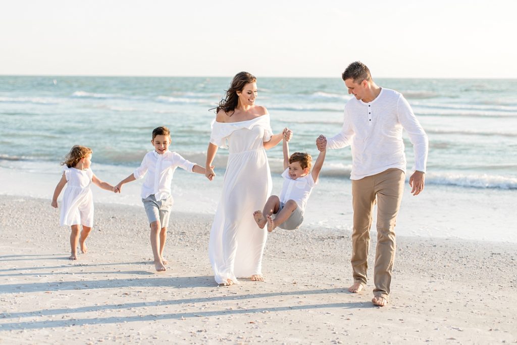 St. Petersburg family photographer taking beautiful photos at Florida sandy beach