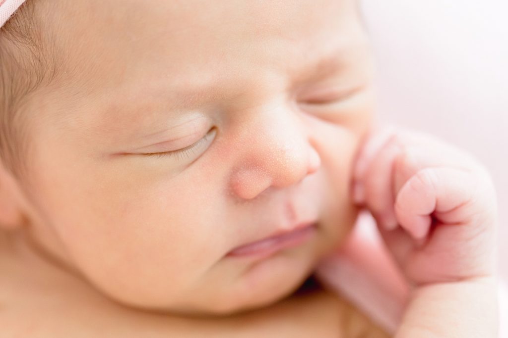 Newborn natural lighting Tampa photographer taking beautiful baby studio photos