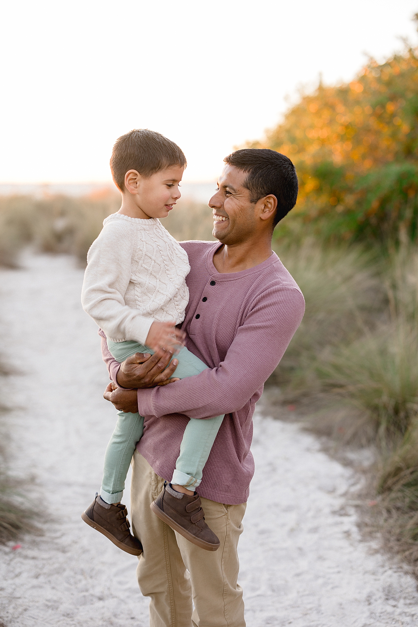 Father-son photo on the beach. Photos by Brittany Elise Photography.