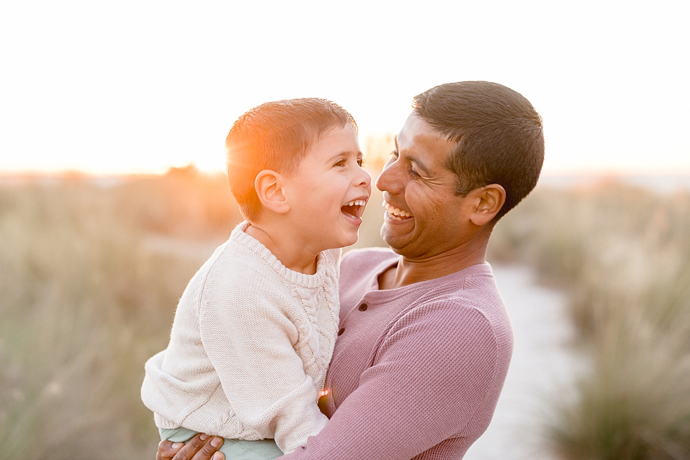Father-son photo on the beach at sunset. Photos by Brittany Elise Photography.