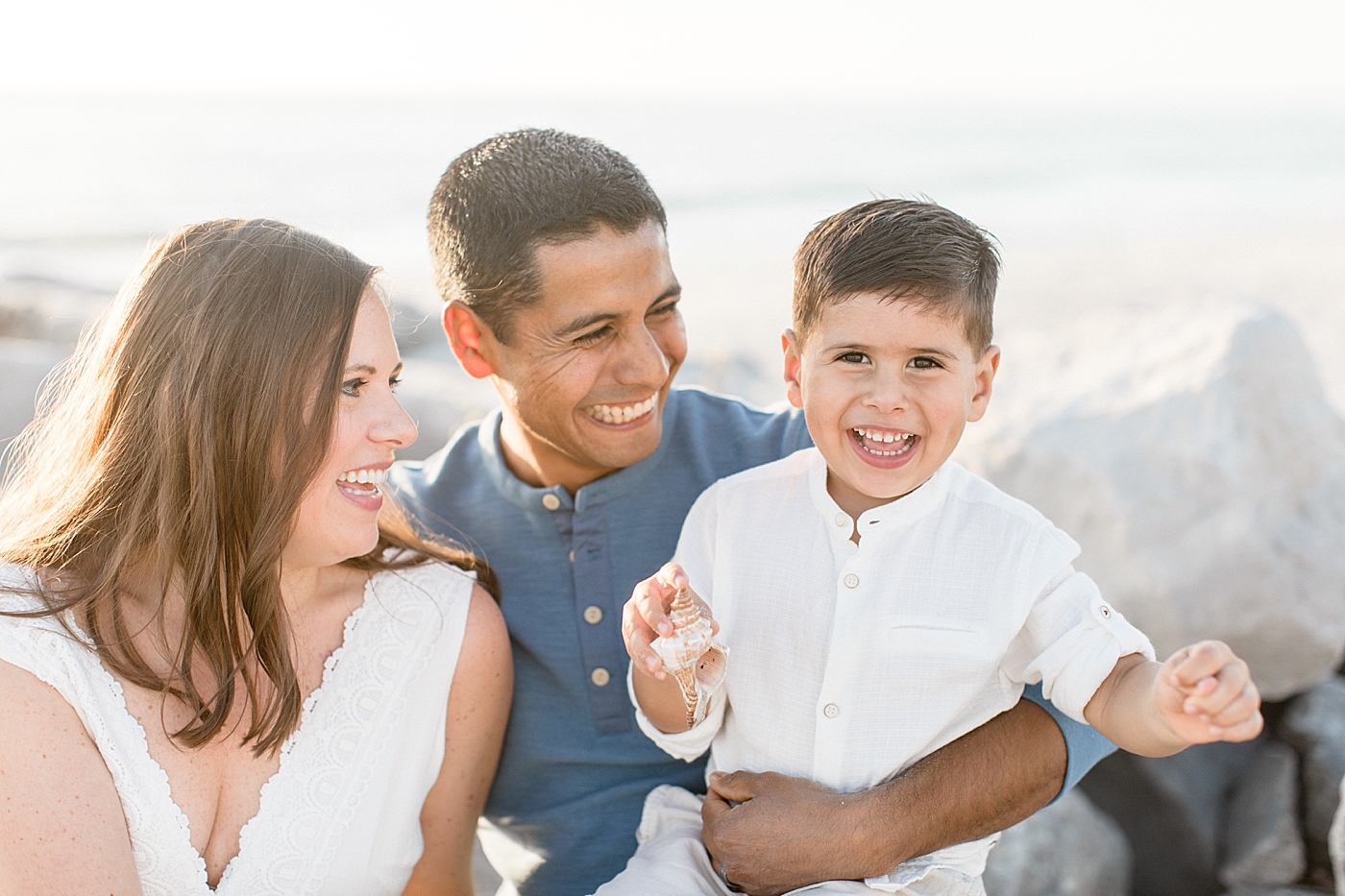 Sunset family session with Mom, Dad and son. Photos by Brittany Elise Photography.