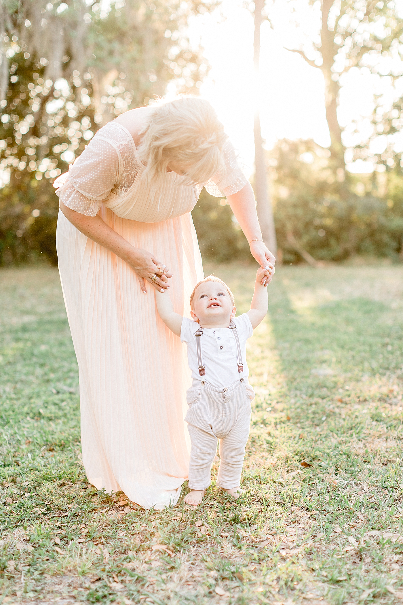  One year old son looking up at his Mom. Photo by Brittany Elise Photography.