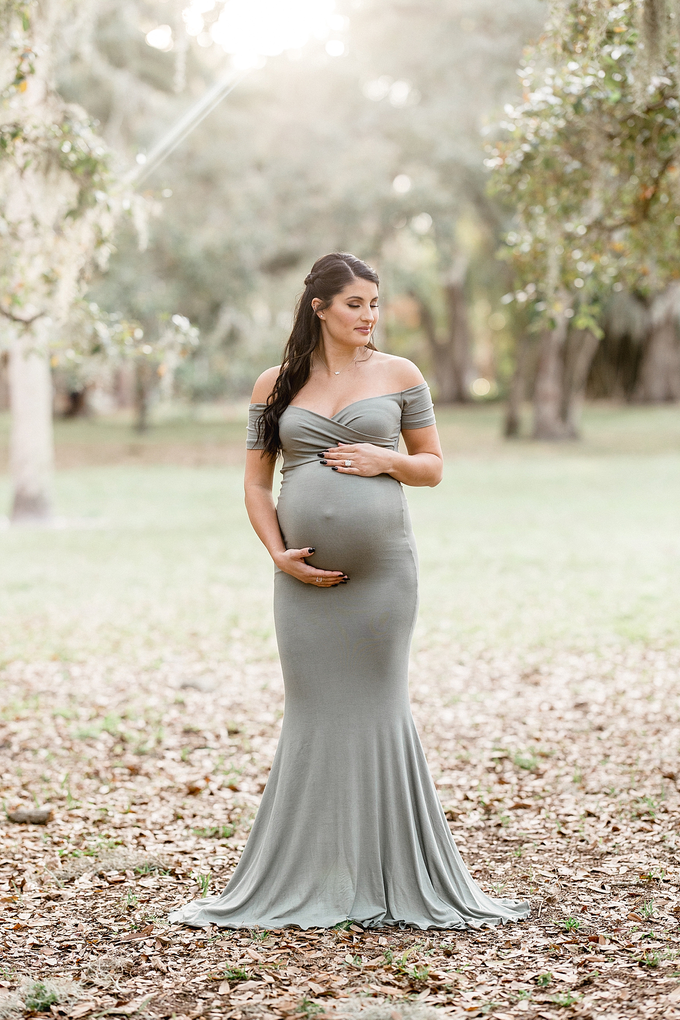 Sunset maternity session under the oaks in Tampa. Photo by Brittany Elise Photography.
