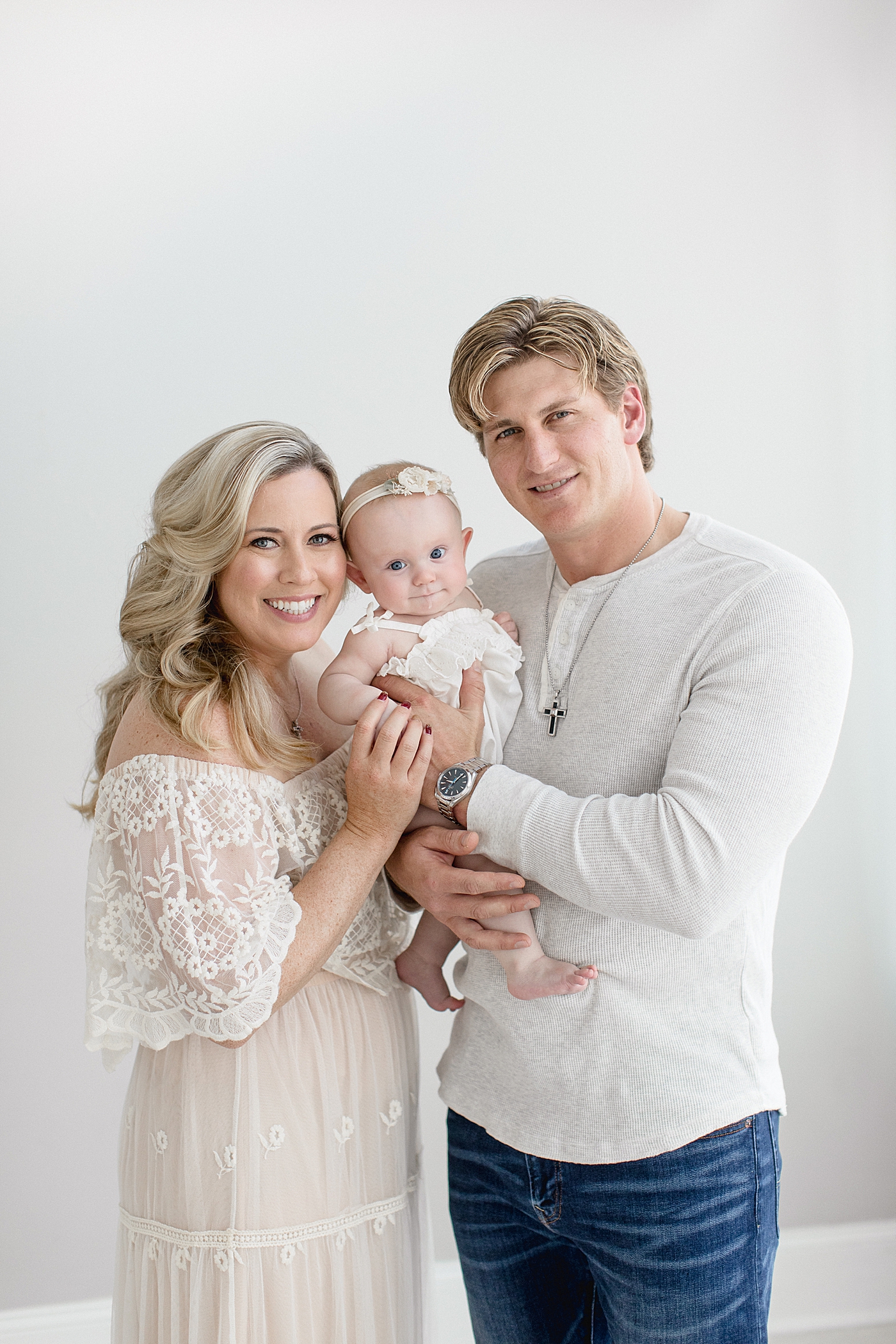 Family portrait at baby girls six-month milestone session. Photo by Brittany Elise Photography.
