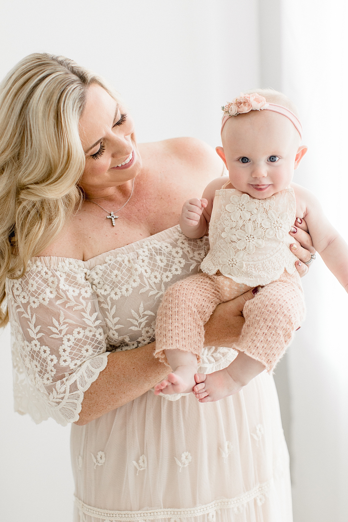 LPGA Pro Golfer, Brittany Lincicome, holding her baby girl. Photo by Brittany Elise Photography.