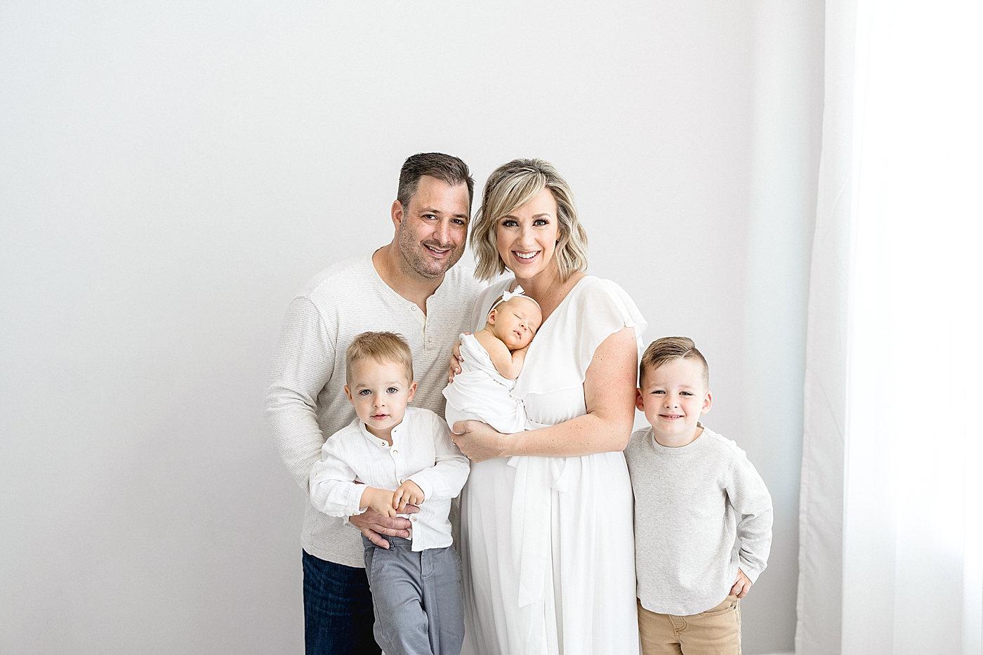 Family portrait during baby girl's studio newborn session with Brittany Elise Photography.
