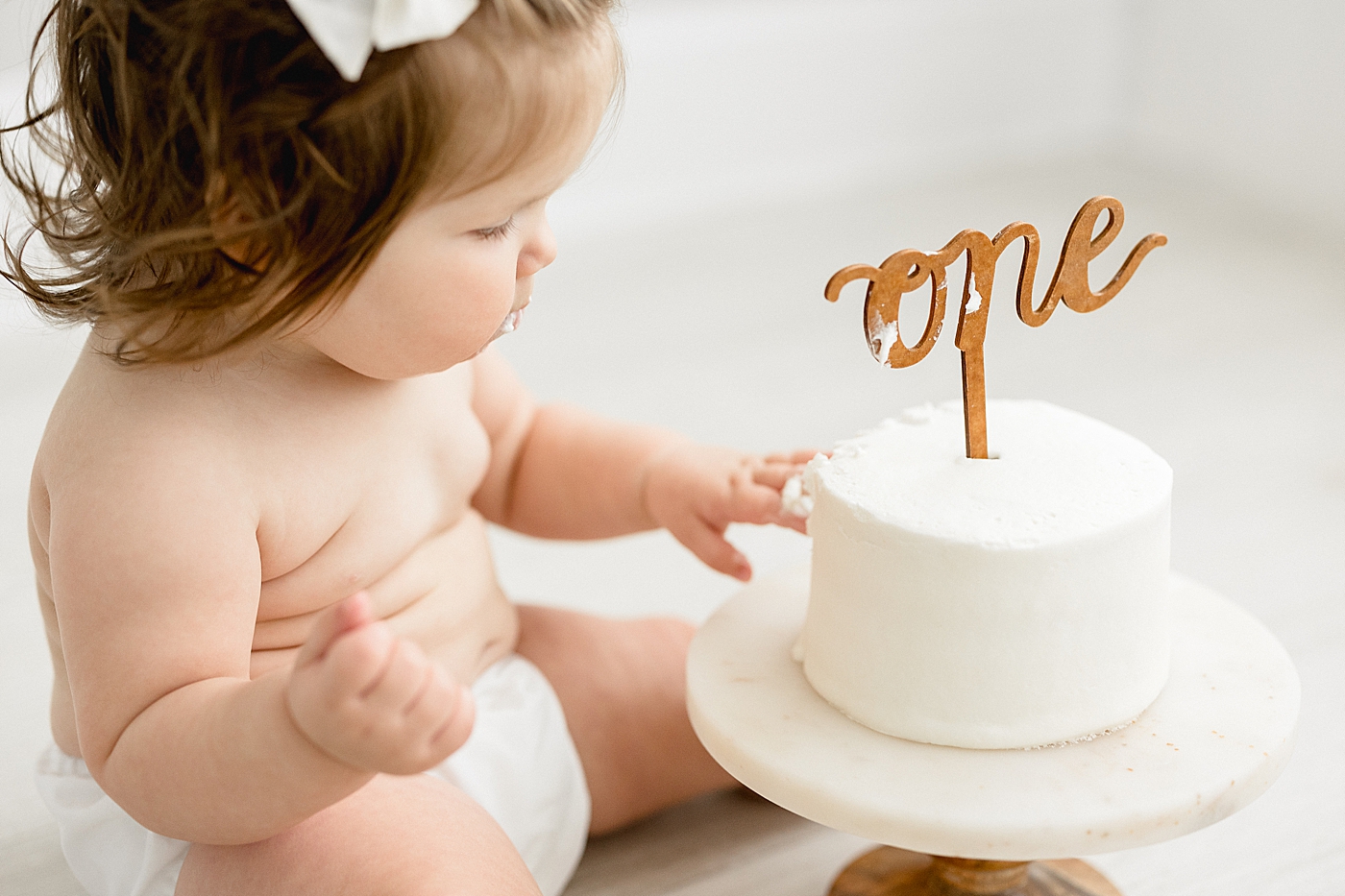 Cake smash for first birthday in Tampa studio. Photo by Brittany Elise Photography.