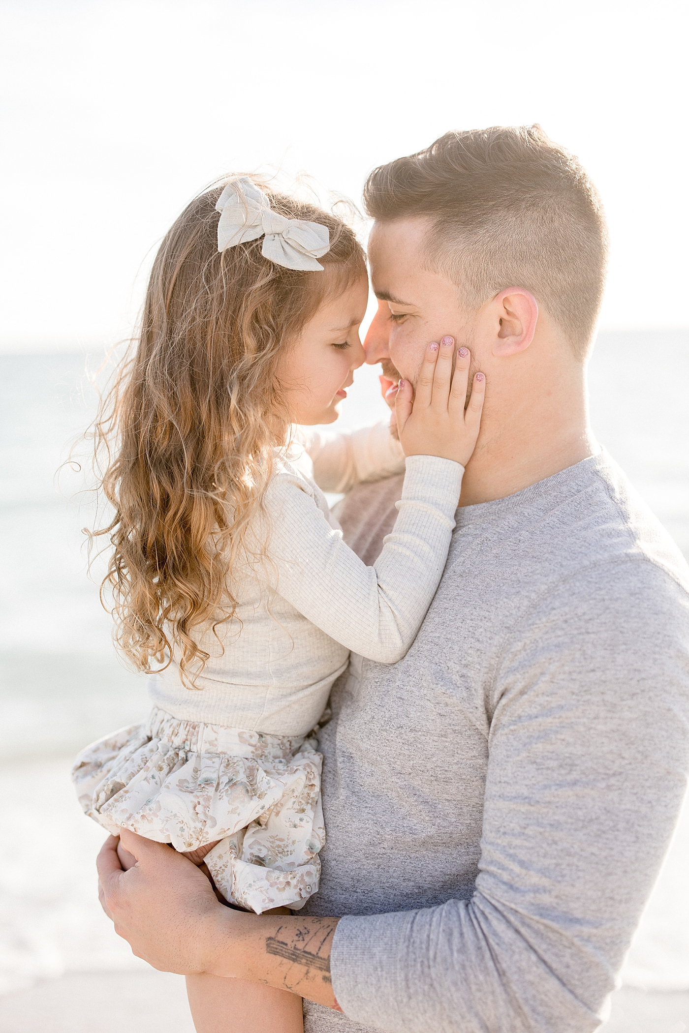 Sweet moment between Dad and his daughter. Photo by Brittany Elise Photography.