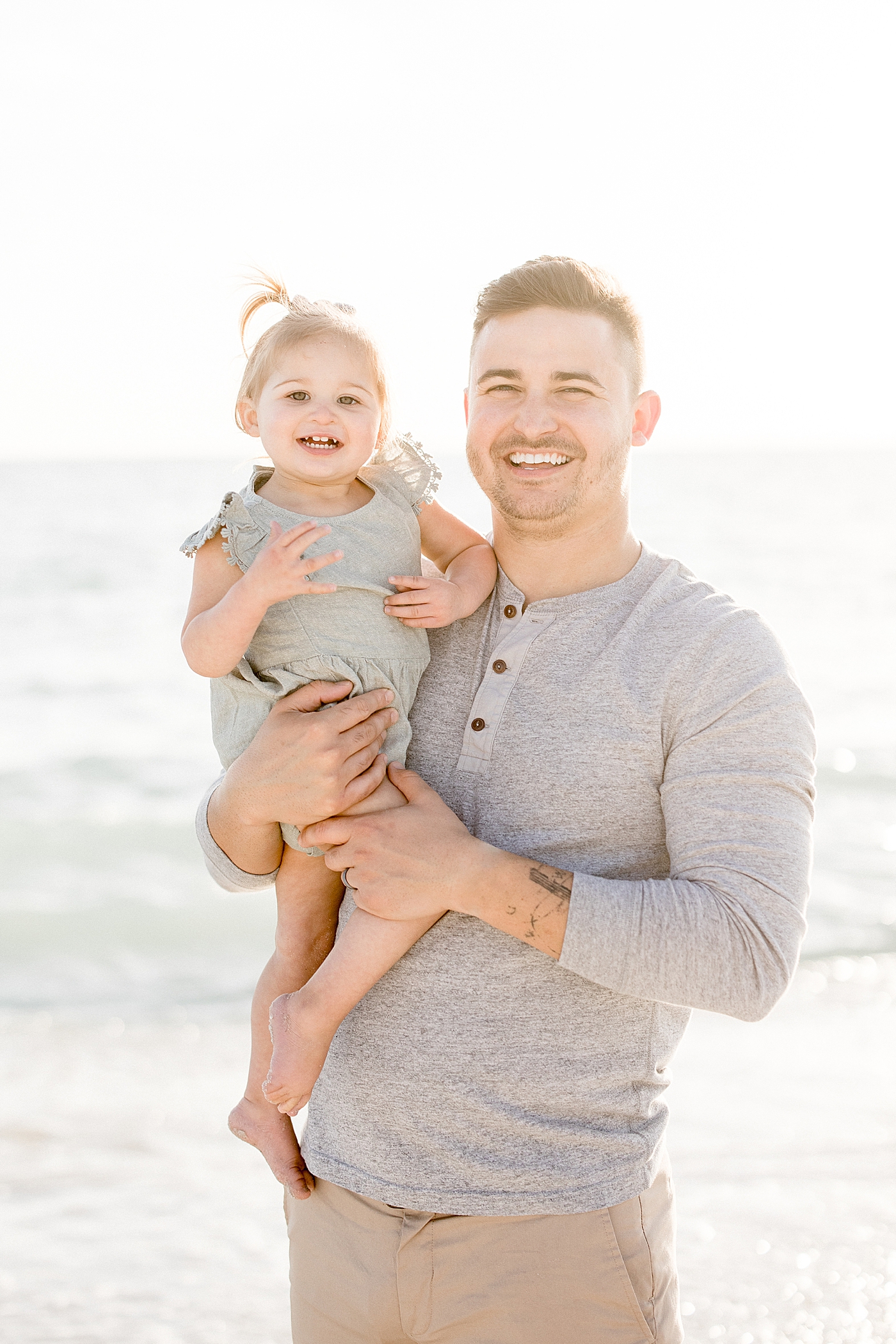 Dad and his baby girl at sunset on St. Pete Beach. Photo by Brittany Elise Photography.