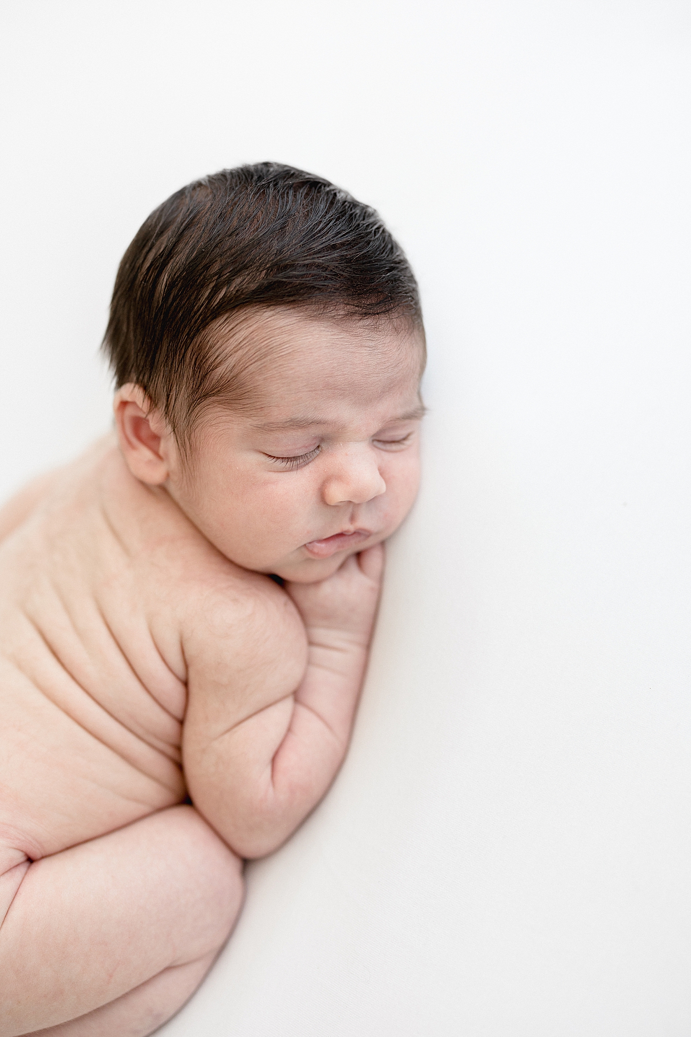 Baby led posing for newborn session. Photo by Brittany Elise Photography.