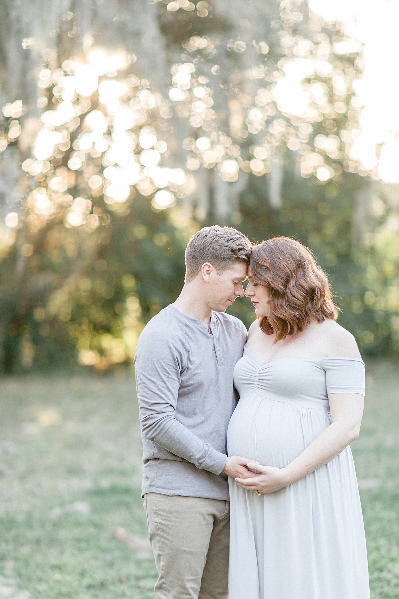 Sunset maternity session under the oaks in Tampa, FL. Photo by Brittany Elise Photography.