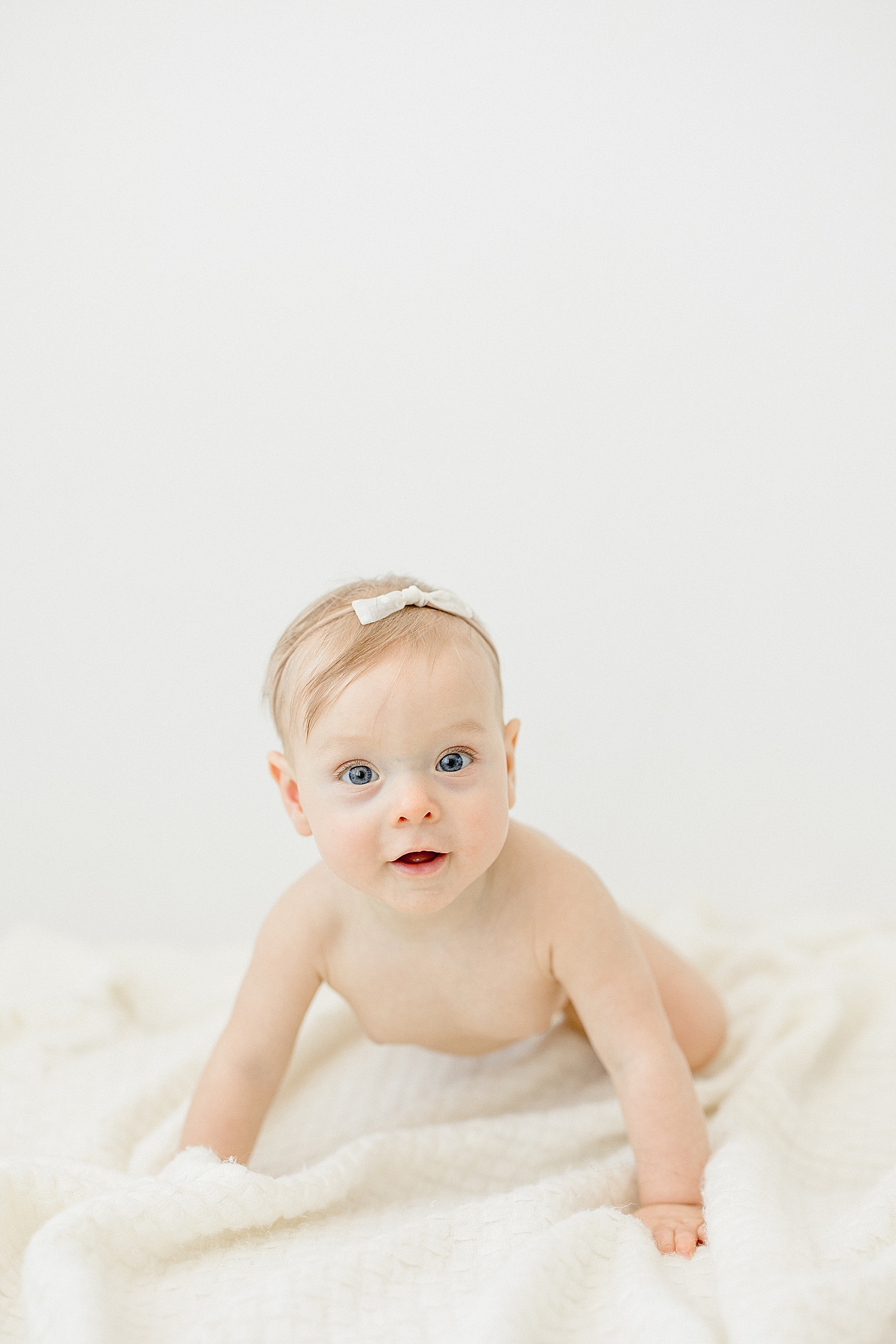 Tampa baby photographer, Brittany Elise Photography, photographs six month old milestone session in studio.