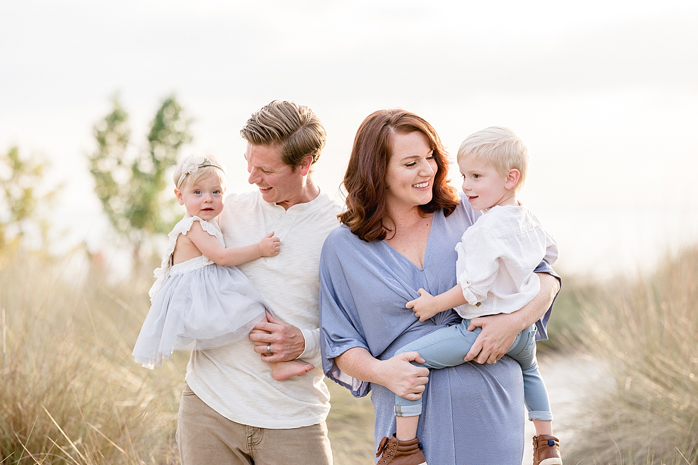 Family portraits at sunset at Cypress Point Park in Tampa, FL. Photo by Brittany Elise Photography.