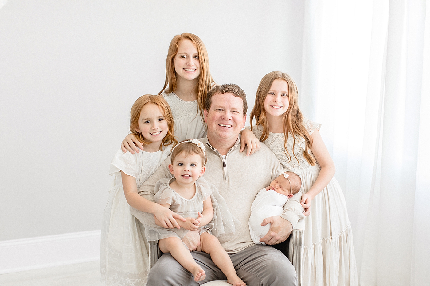 Dad and his five girls at youngest daughter's newborn session. Photo by Brittany Elise Photography.