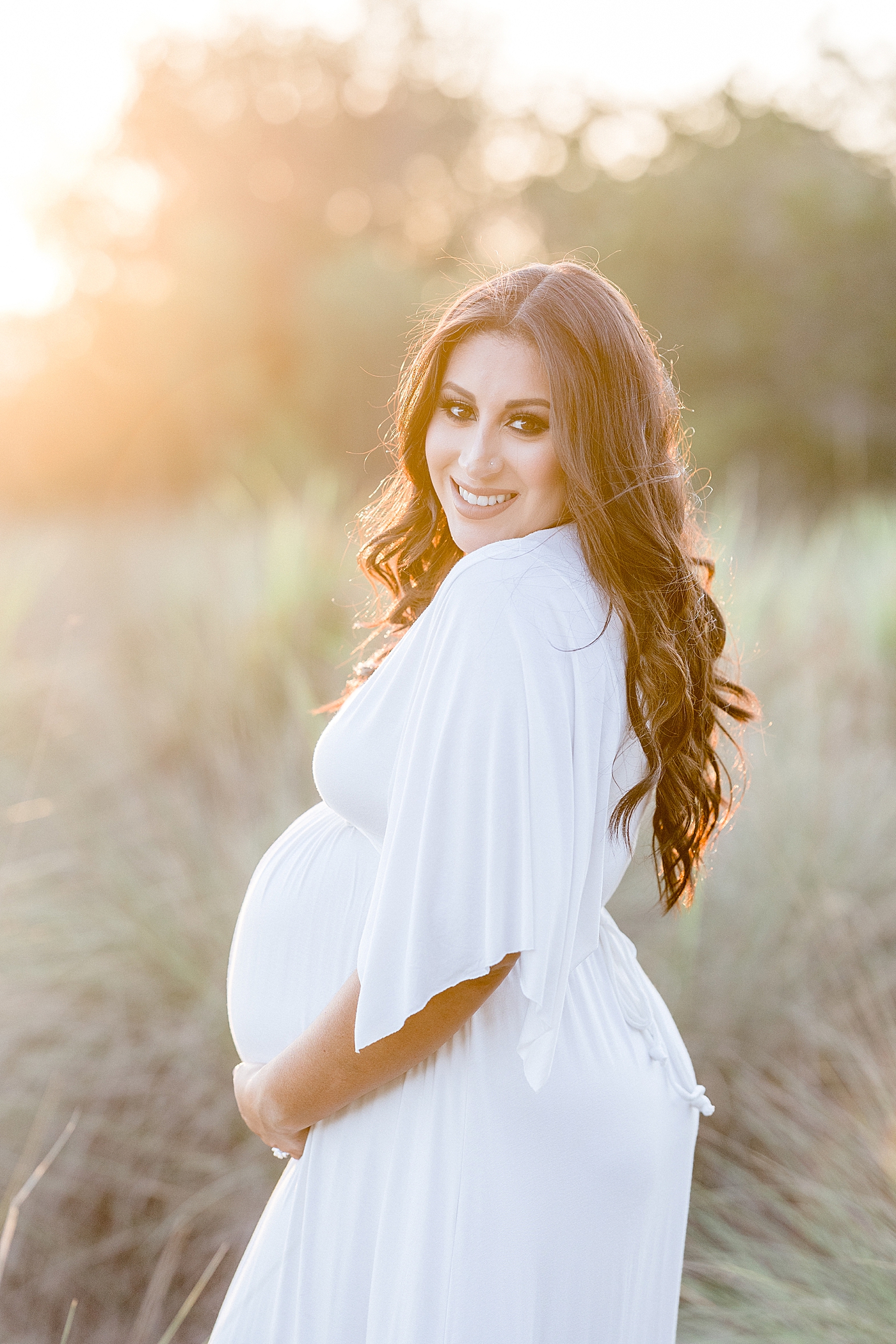 Golden hour sunset photo for pregnant momma. Photo by Brittany Elise Photography.