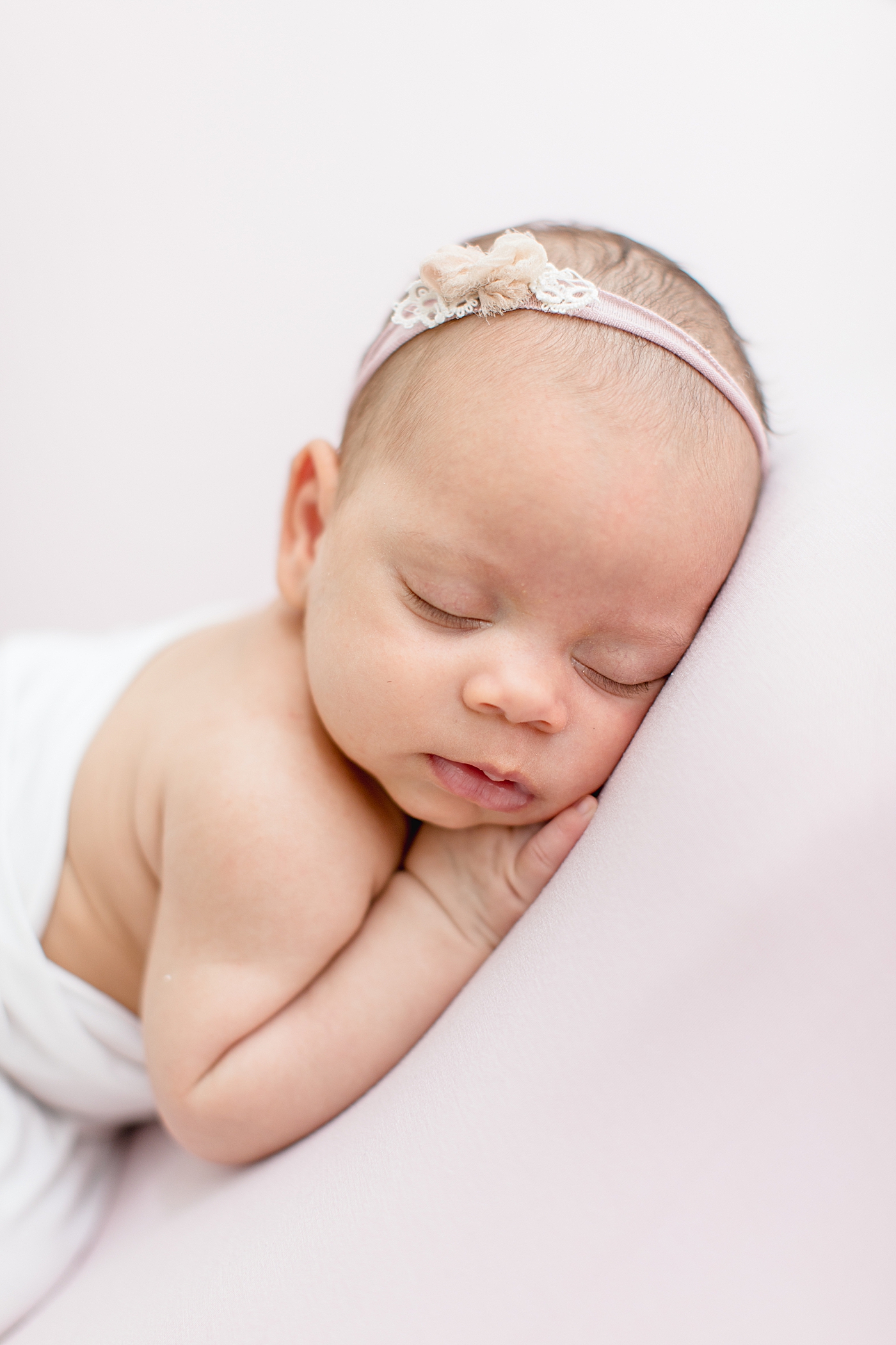 Baby girl sleeping for newborn photos. Photo by Brittany Elise Photography.