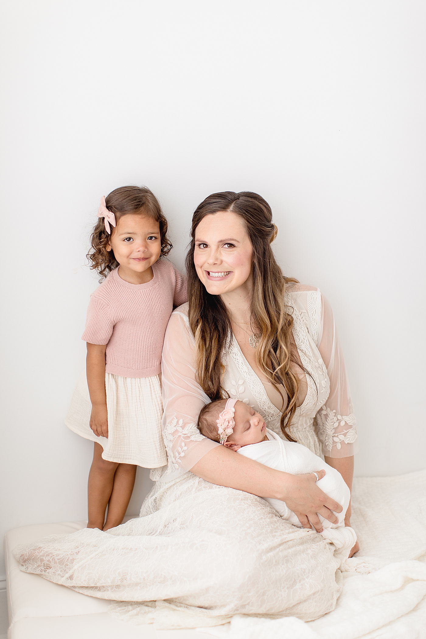 Mom with her two girls. Photo by Brittany Elise Photography.
