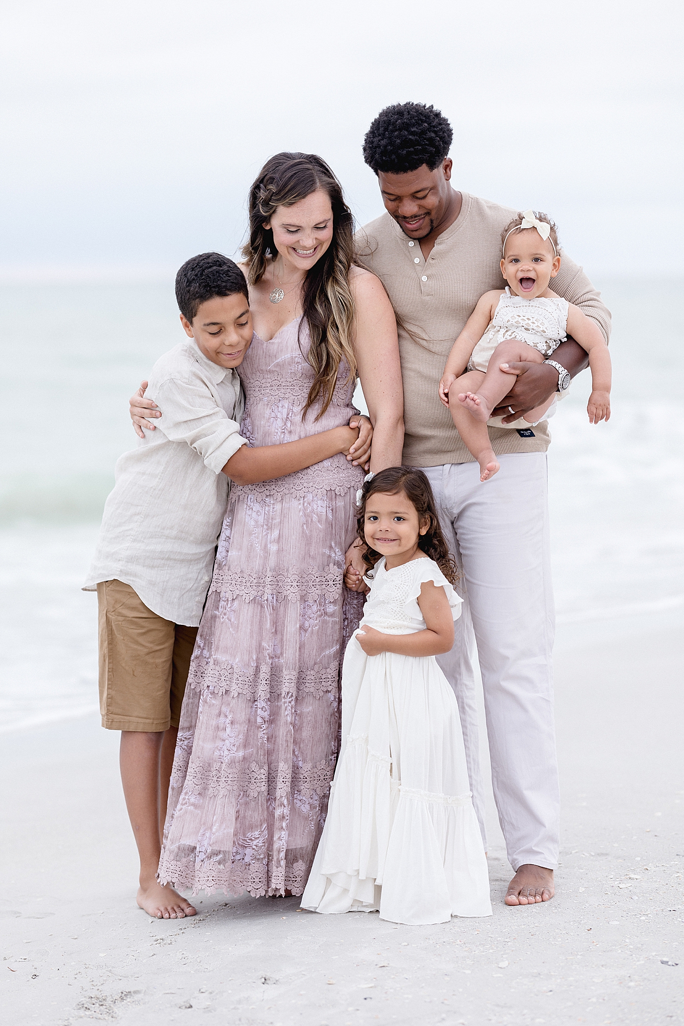 Family portraits on the beach in Tampa, FL. Photo by Brittany Elise Photography.