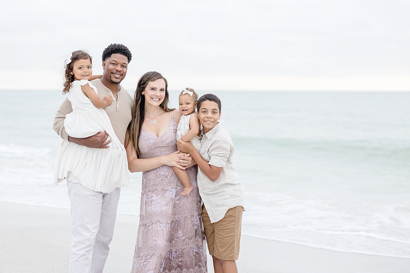Family portraits on St. Pete beach. Photo by Brittany Elise Photography.