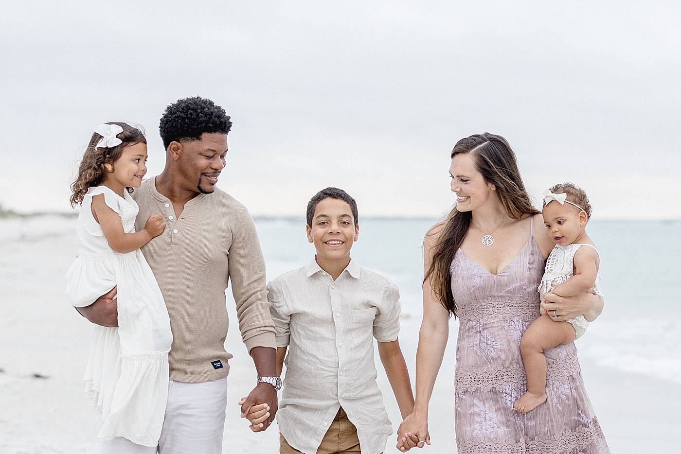 Family photos on the beach. Photo by Brittany Elise Photography.
