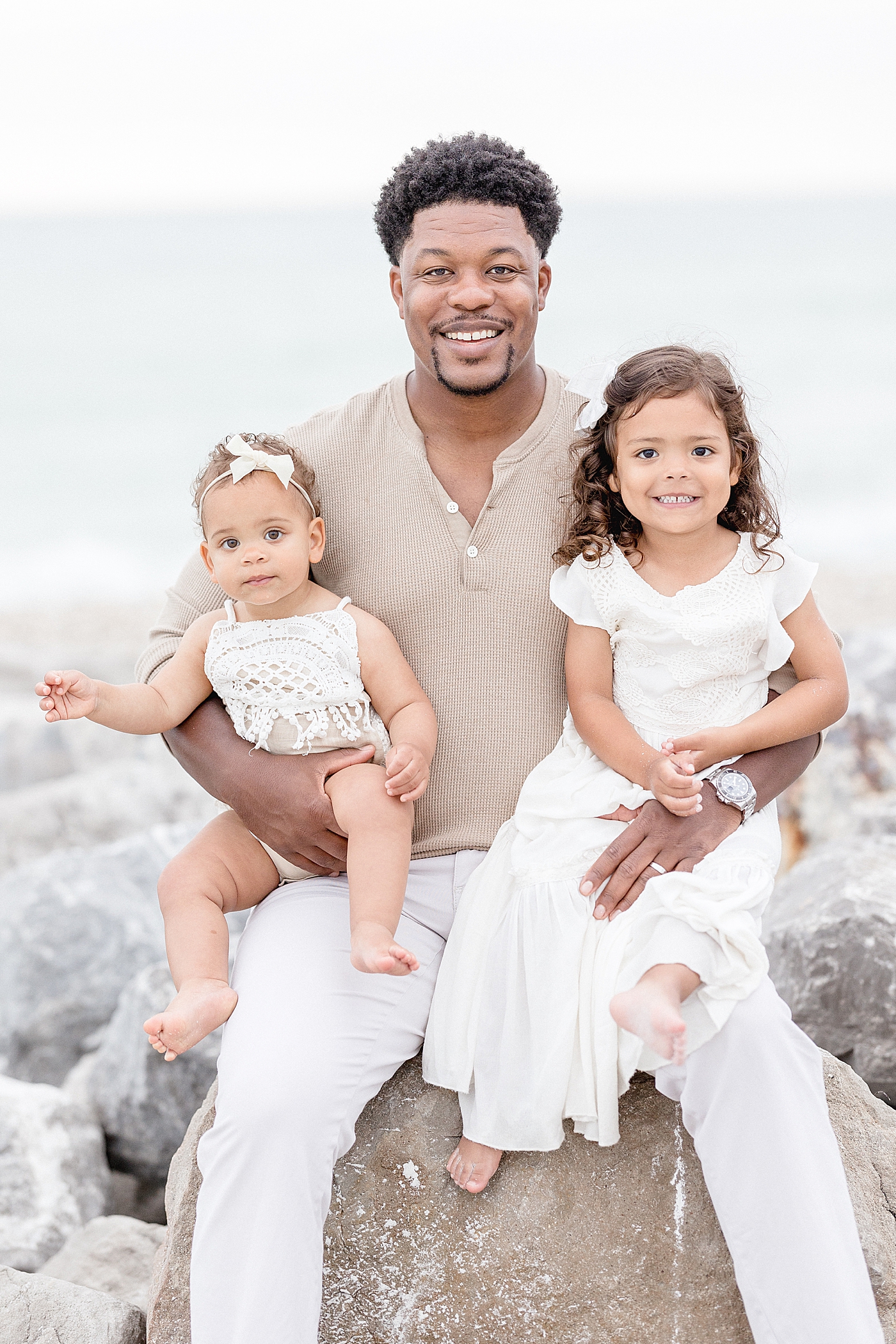 Daddy and his two girls. Photo by Brittany Elise Photography.