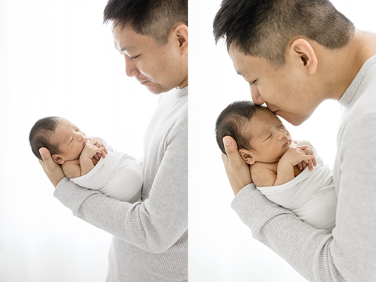 Sweet moments between father and son during newborn session with Brittany Elise Photography.