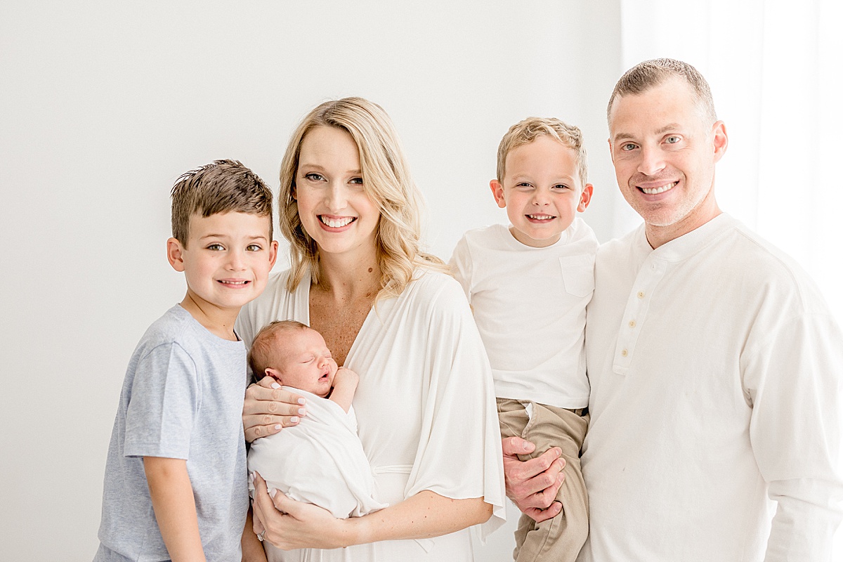Family portrait during newborn session for family of five. Photo by Brittany Elise Photography.