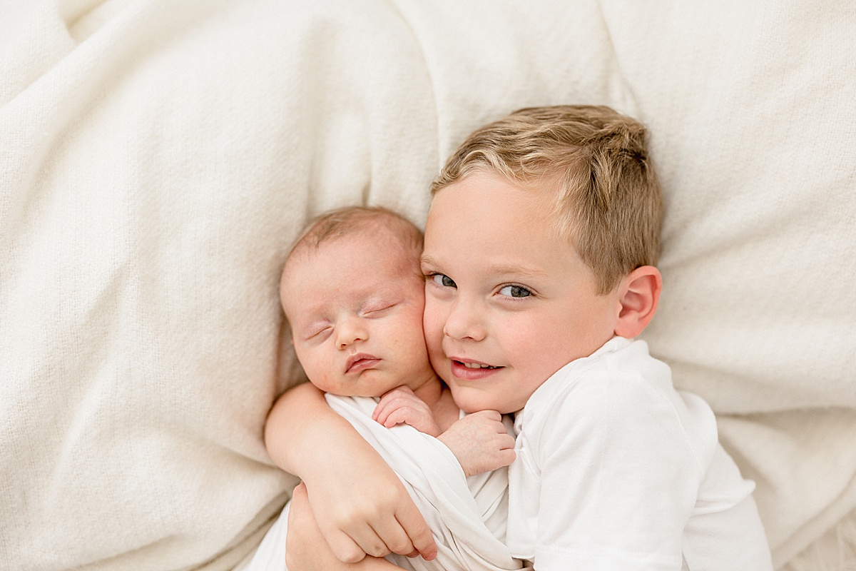 Sibling photos during newborn session. Photo by Brittany Elise Photography.