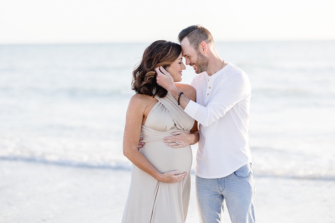 Mom and Dad looking at each other during maternity session. Photo by Brittany Elise Photography.