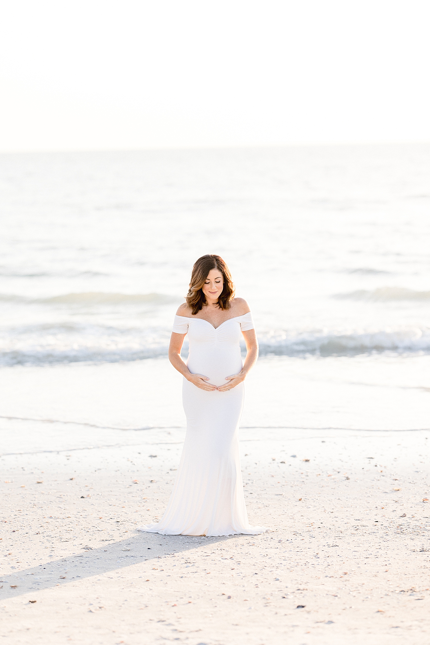 Golden hour maternity session in St. Pete Beach. Photo by Brittany Elise Photography.