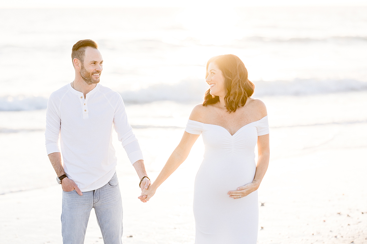 Sunset maternity session on the beach. Photo by Brittany Elise Photography.