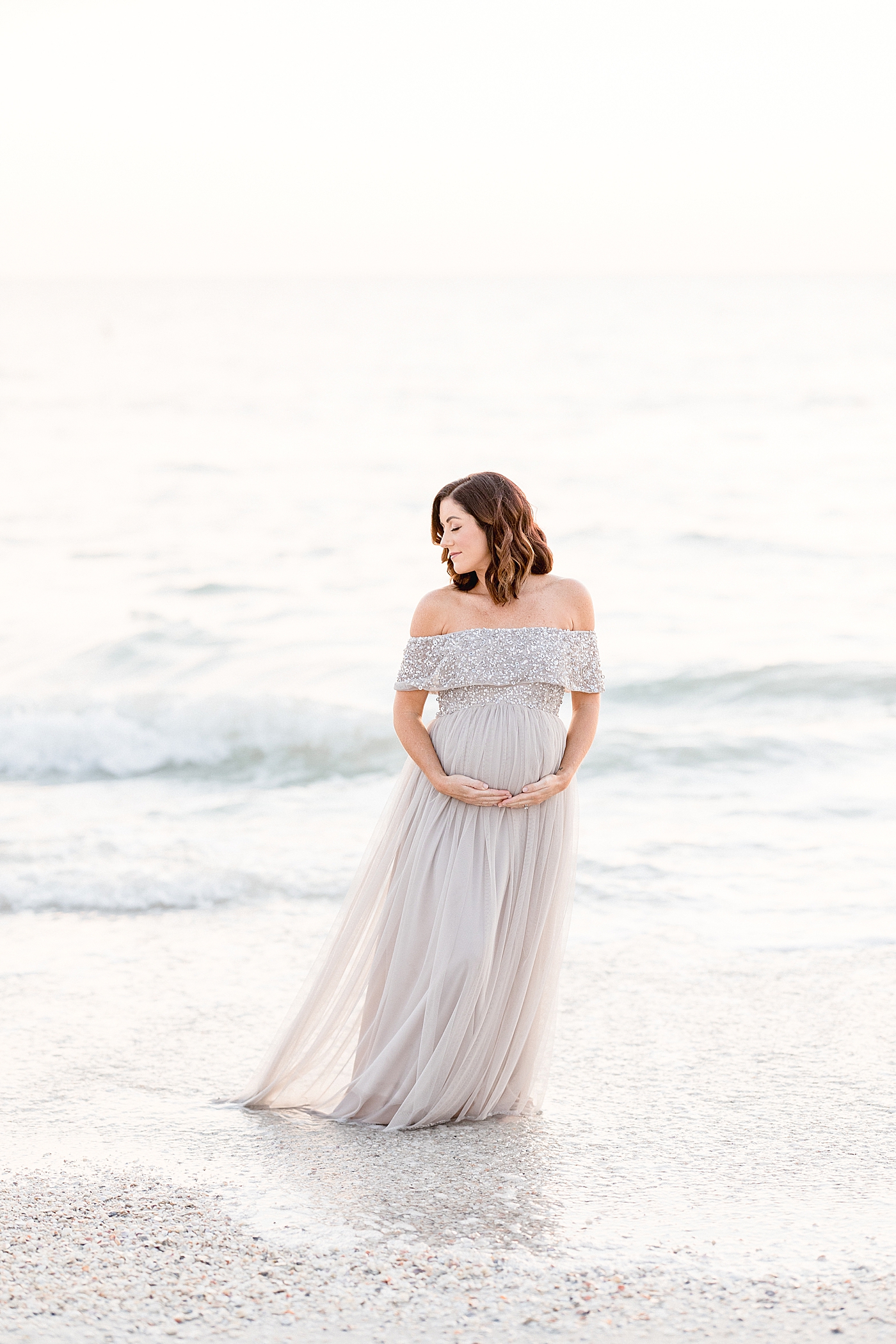 Maternity session on the beach with Mom in long, beautiful dress. Photo by Brittany Elise Photography.