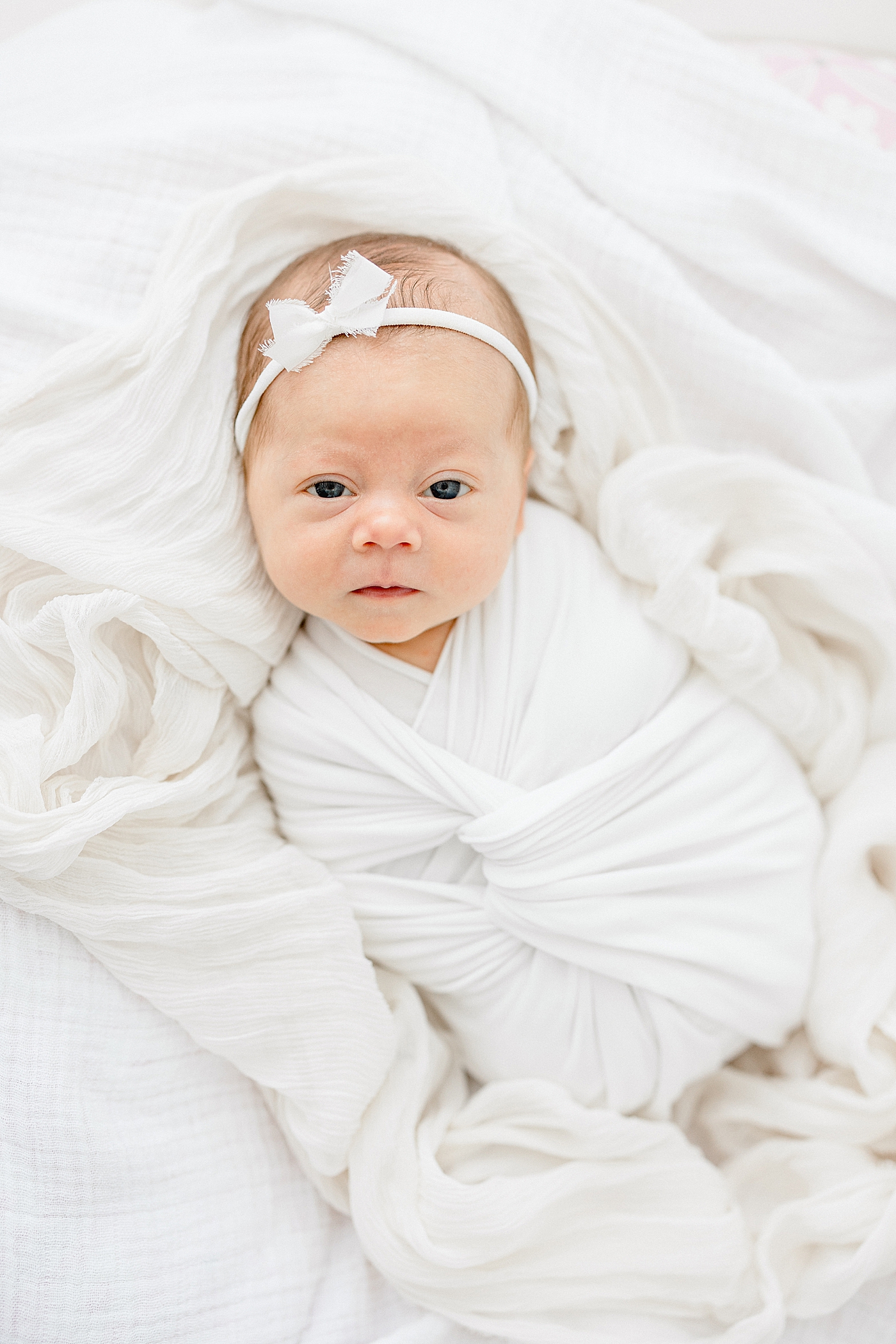 Awake photo of newborn baby girl. Photo by Brittany Elise Photography.