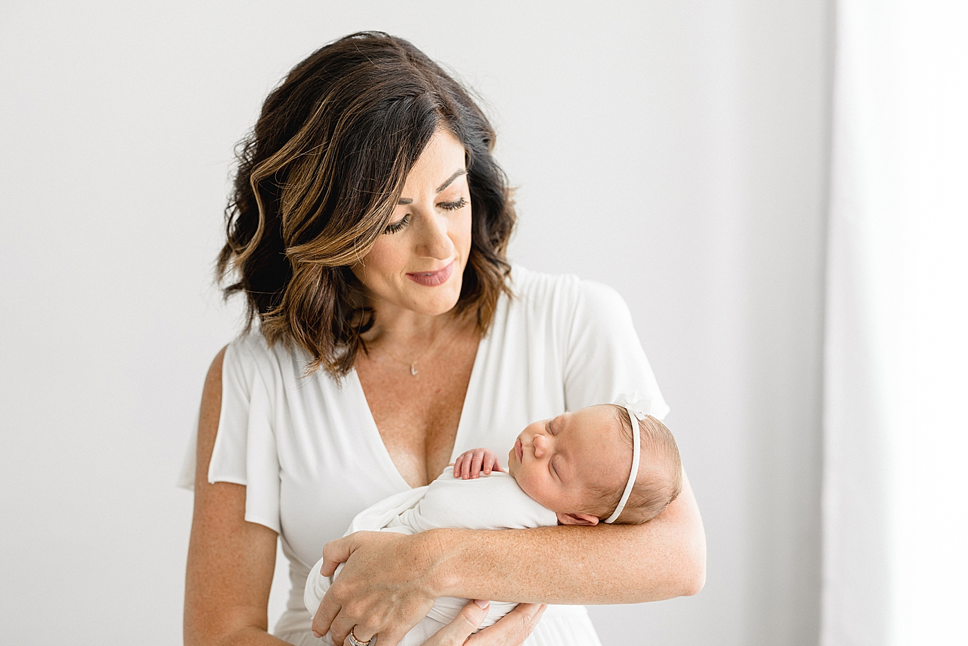 Mother-daughter photos during newborn session. Photo by Brittany Elise Photography.