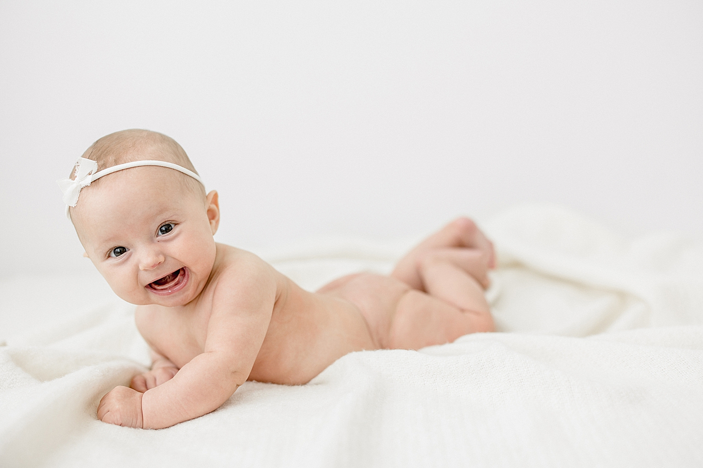 3 month old baby girl smiling big for milestone photos with Mom, Brittany Elise Photography.