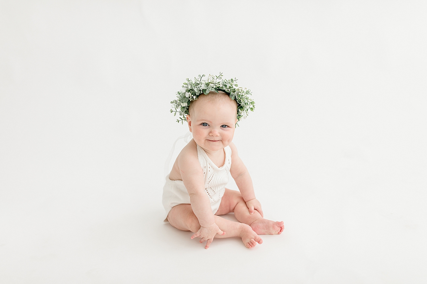 Baby girl with flower crown. Photo by Brittany Elise Photography.