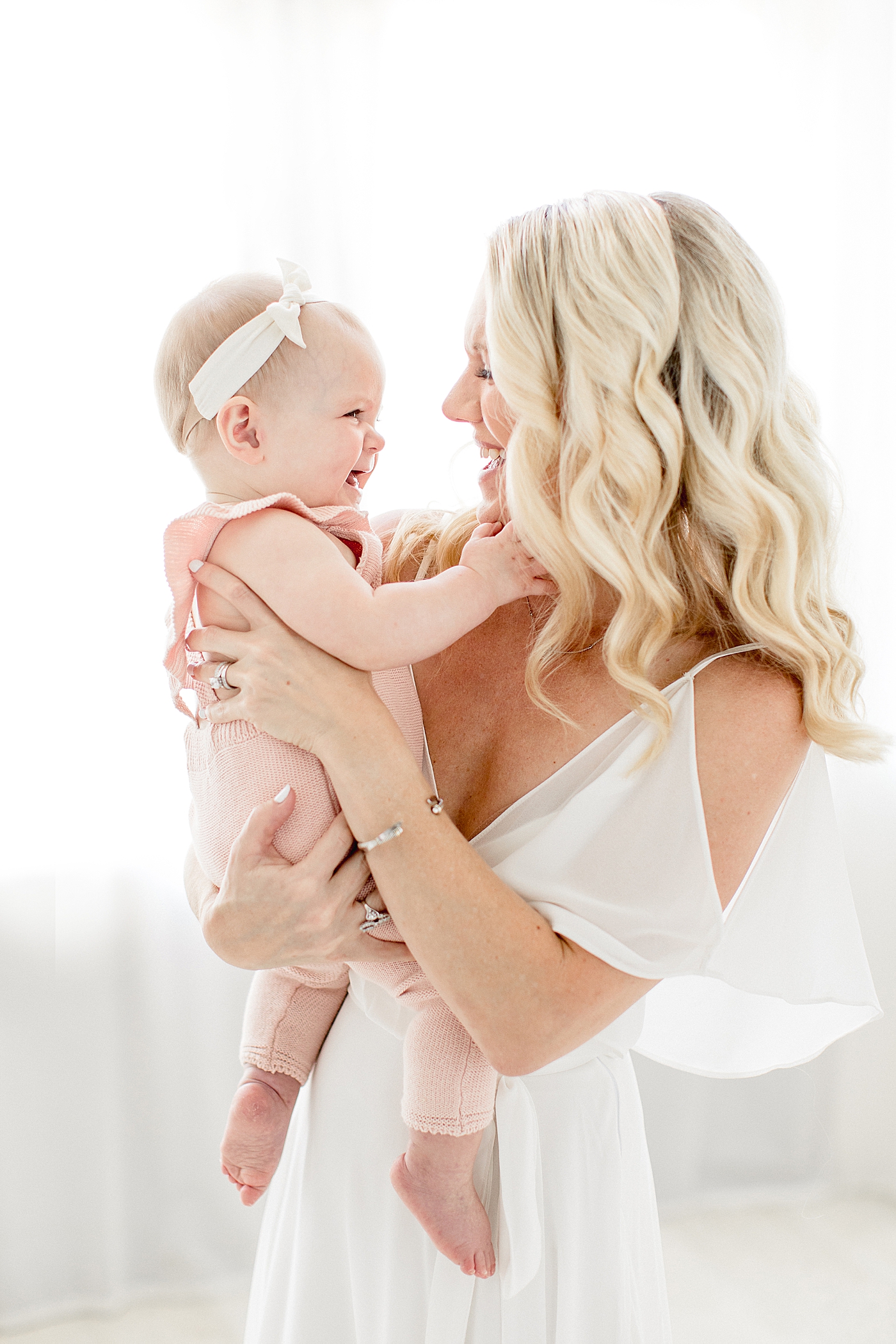 Mom and baby girl looking at each other at nine months old. Photo by Brittany Elise Photography.