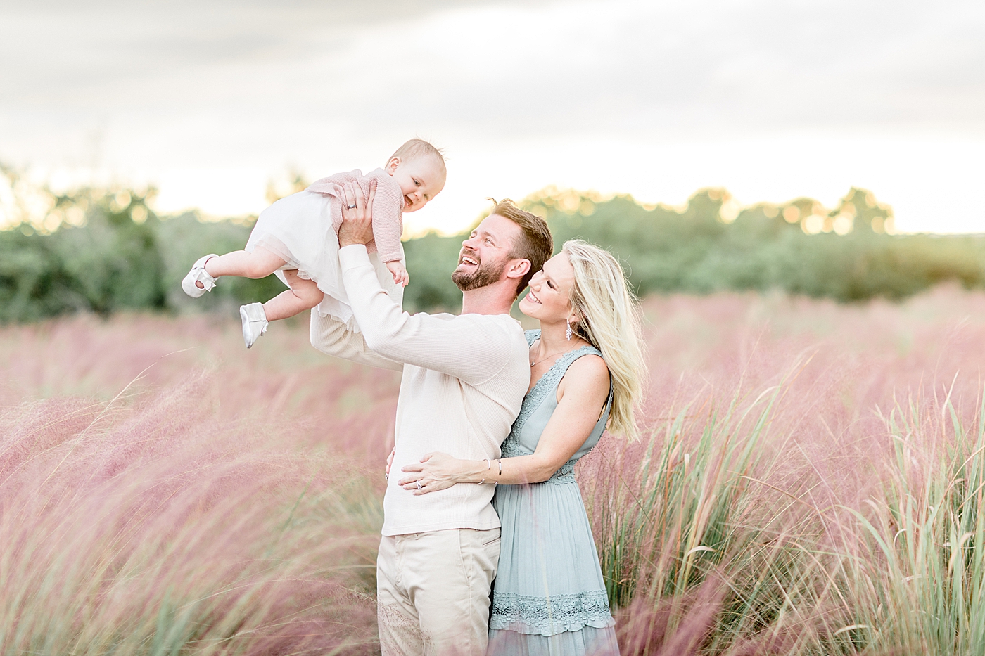 Outdoor family session in the tall grass in Tampa. Photo by Brittany Elise Photography.