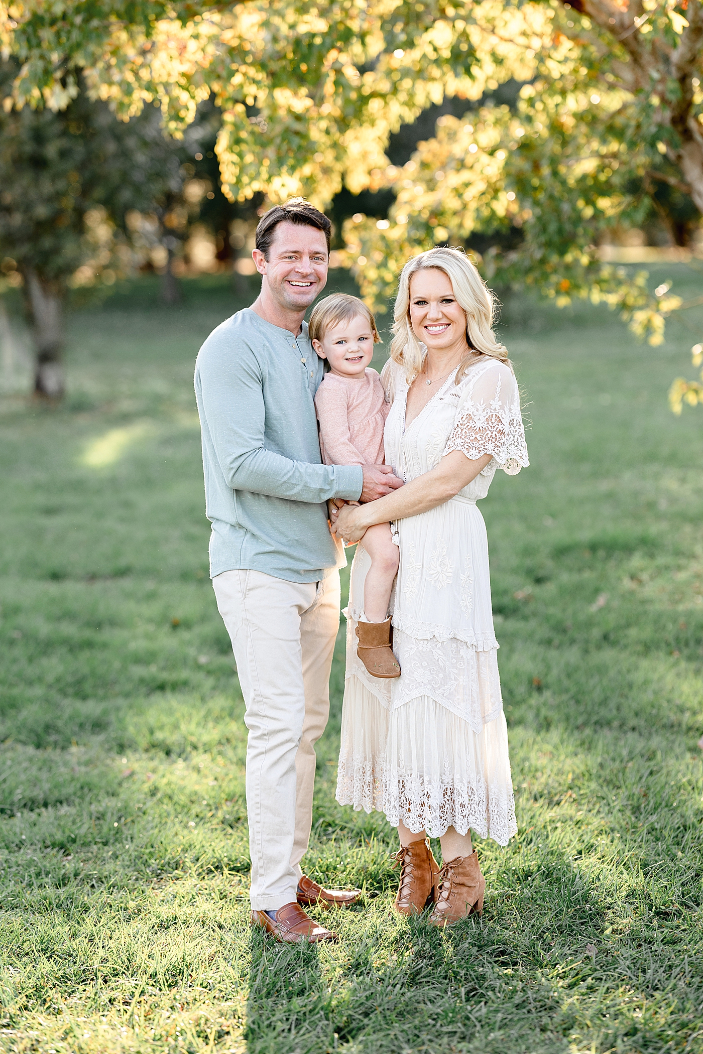 Sunset family session with parents and two year old daughter. Photo by Brittany Elise Photography.
