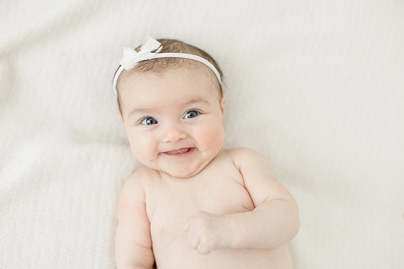 3 month milestone simplicity session in studio for baby girl. Photo by Brittany Elise Photography.