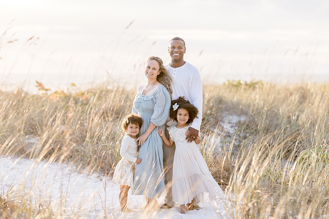 Sunset beach session for family of four. Photo by Brittany Elise Photography.