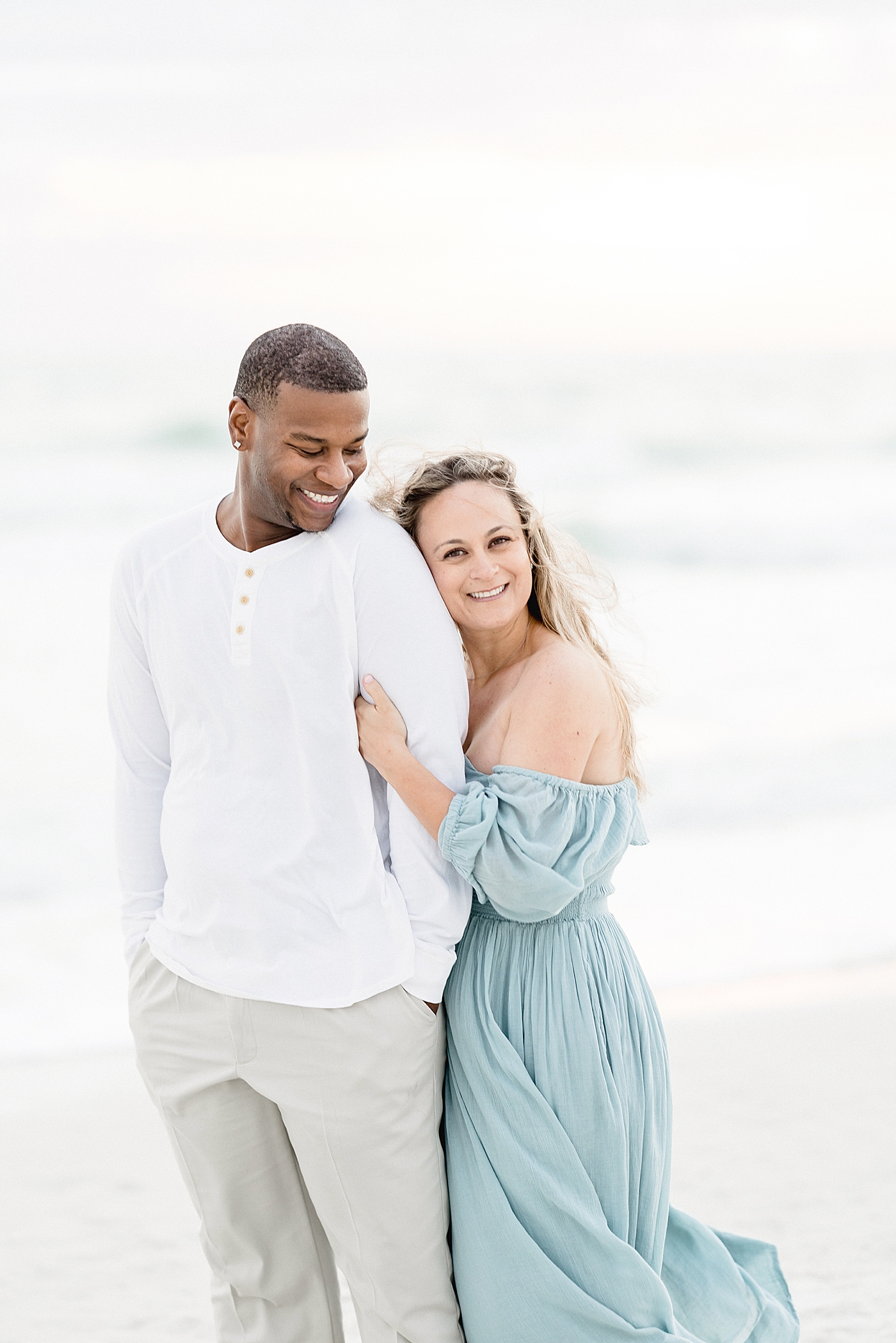 Husband and wife photos on the beach. Photo by Brittany Elise Photography.