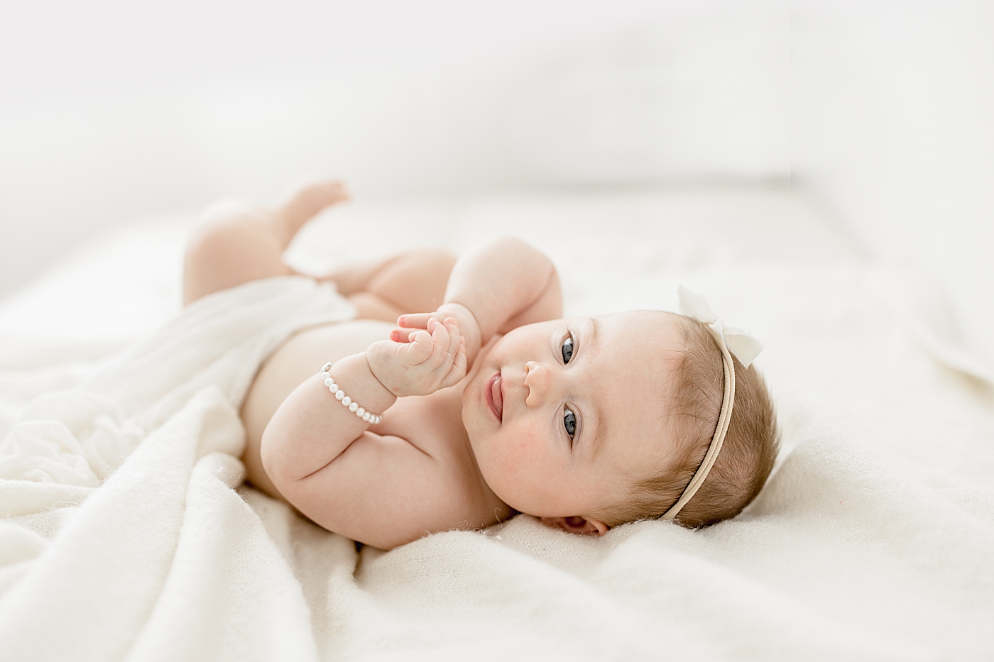 Studio milestone session for six month old baby girl. Photo by Brittany Elise Photography.