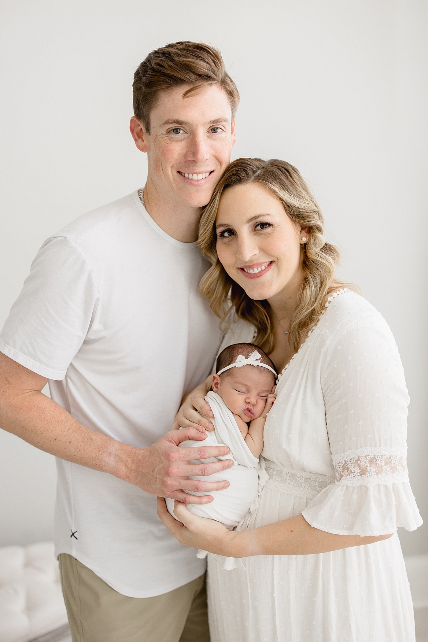 Family portrait for new parents with baby girl. Photo by Brittany Elise Photography.